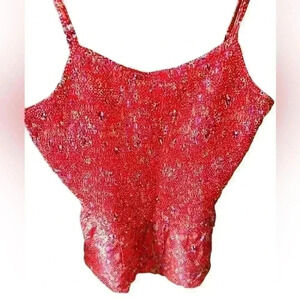 Size large red floral smocked camisole /tank top with peplum and adj. straps.